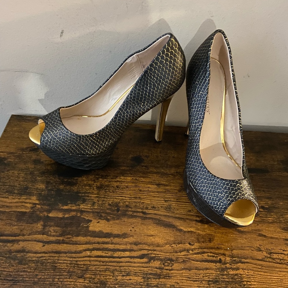 Black and gold stilettos